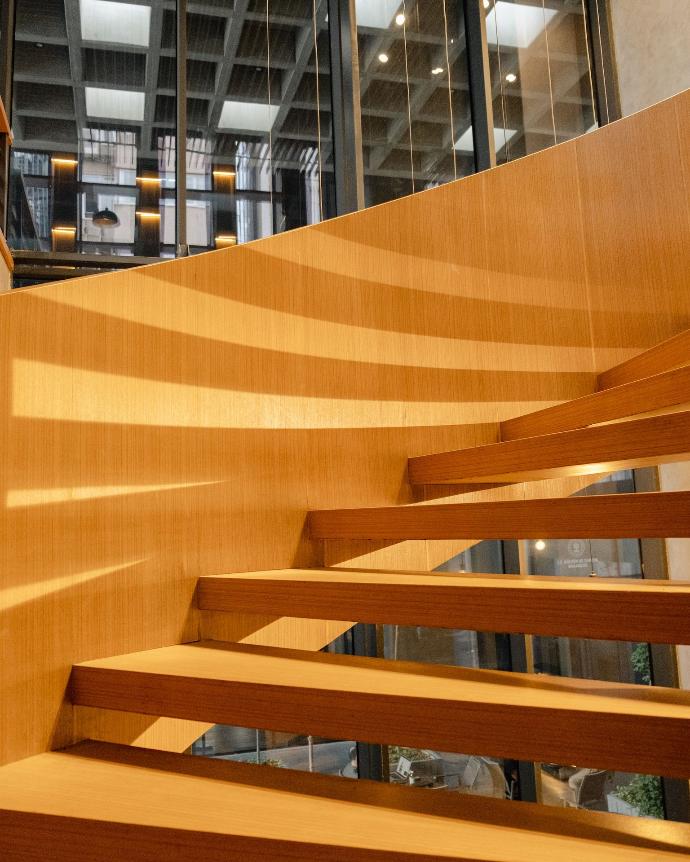 a close up of a wooden stair case in a building