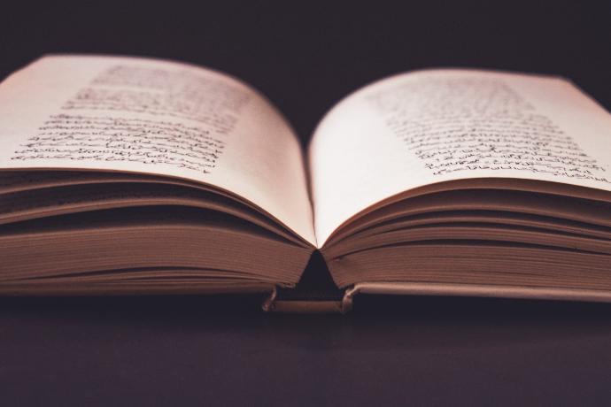 an open book sitting on top of a table